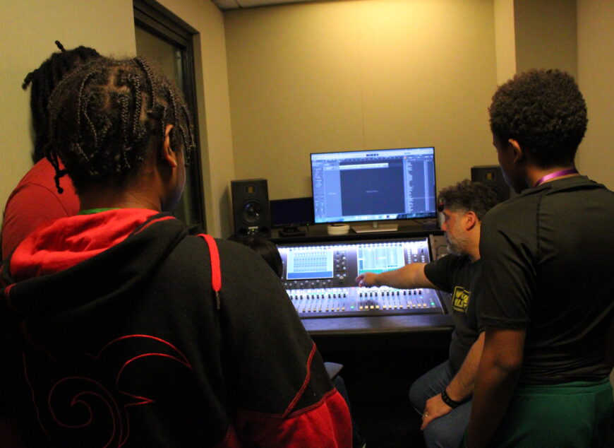 Students learning around technology.