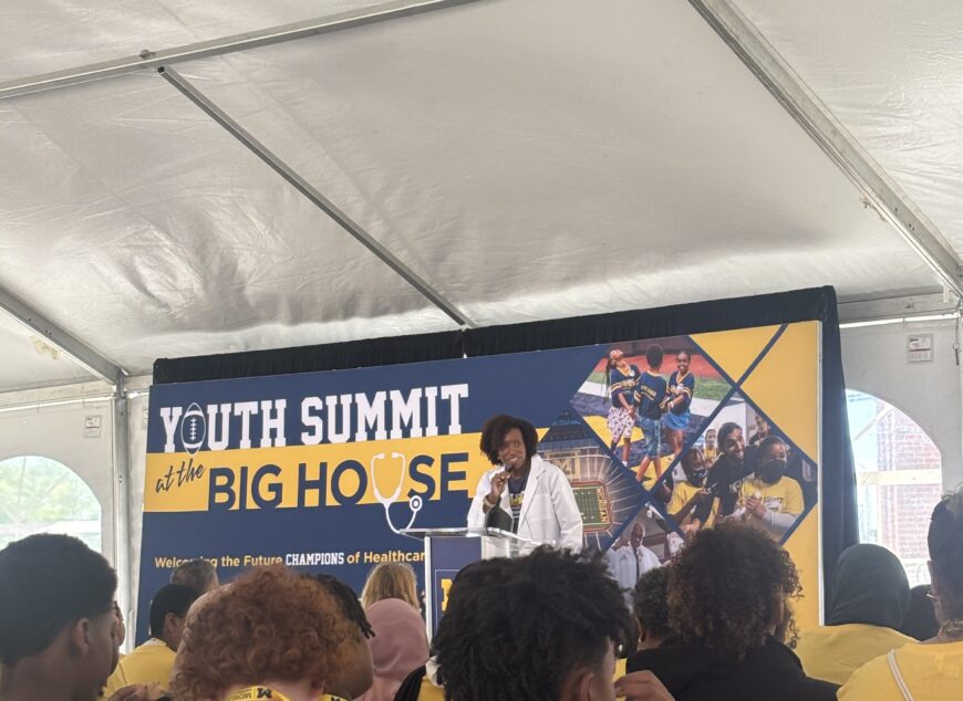 Students sitting together at a Youth Summit at The Big House.